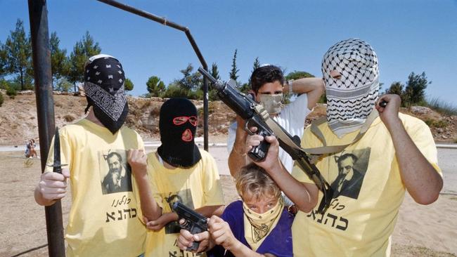 Masked teenagers posed during a 1994 training camp organised by Meir Kahane’s party, Kach. Picture: Yoav Lemmer/ AFP/ Getty Images