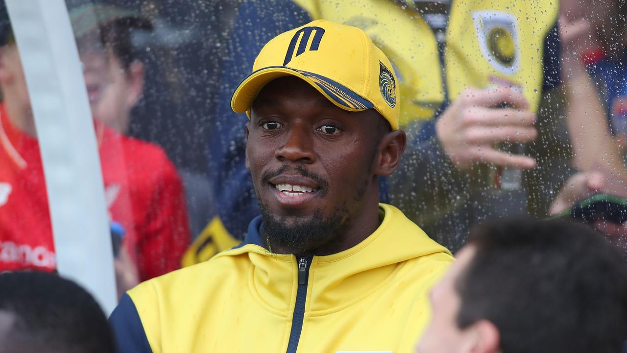 Usain Bolt watches the A-League trial match between the Newcastle Jets and the Central Coast Mariners at Maitland