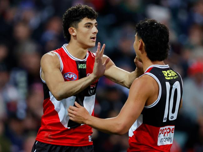 ADELAIDE, AUSTRALIA - APRIL 16: Anthony Caminiti of the Saints celebrates a goal with teammate Mitch Owens during the 2023 AFL Round 05 match between the Collingwood Magpies and the St Kilda Saints at Adelaide Oval on April 16, 2023 in Adelaide, Australia. (Photo by Dylan Burns/AFL Photos via Getty Images)