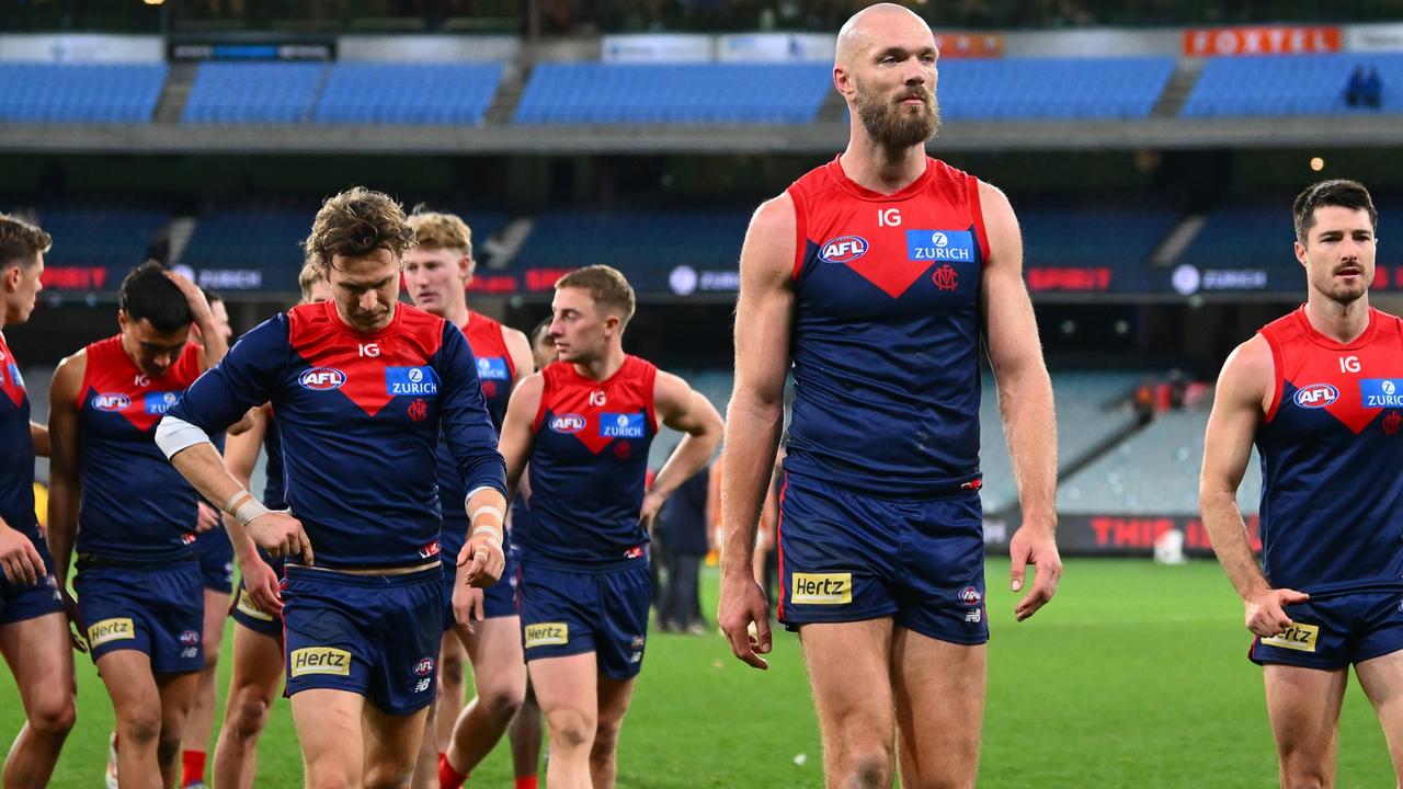 A disappointed Melbourne captain Max Gawn leads the Demons off after their two-point loss to GWS on Saturday night. Picture: Morgan Hancock / Getty Images