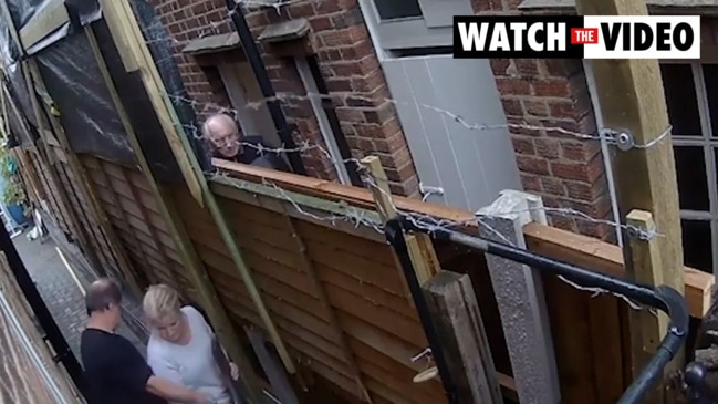 Shocking moment neighbour launches bricks over fence in ‘berserk’ outburst