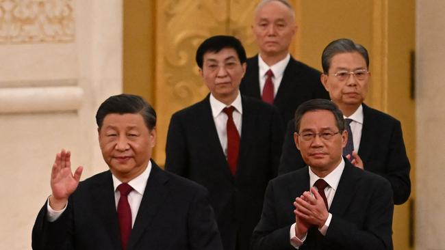 Xi Jinping walks with members of the Chinese Communist Party's new Politburo Standing Committee, the nation's top decision-making body. Picture: AFP