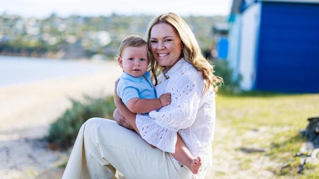 21/02/2025 Emily Rovere with her son Maverick at Safety Beach in Melbourne. Aaron Francis / The Australian