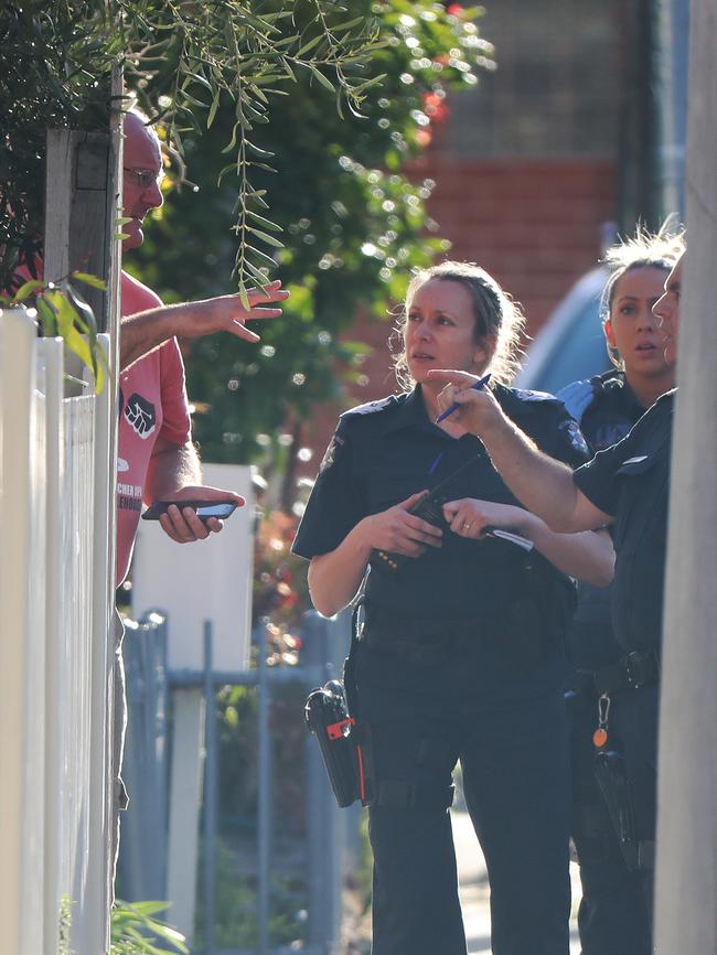 Police talk to witnesses in the street. . Picture: Alex Coppel