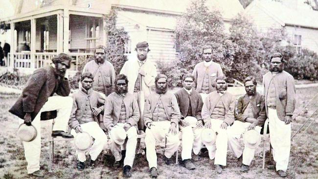 An Aboriginal team was the first to play in a Boxing Day cricket match at the MCG, facing off against a team of European settlers. Standing at rear: cricketer Tarpot, coach Tom Wills and cricketer Johnny Mullagh. Front: Cricketers King Cole, Jellico, Peter, Red Cap, Harry Rose, Bullocky, Cuzens and Dick-a-Dick.