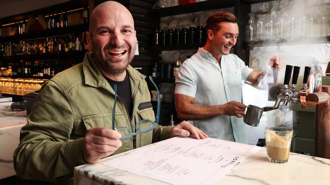 George Calombaris is now a consultant at Hotel Sorrento. Pictured here with co-owner Marcus Pitt as he looks over the menu. Picture: David Caird