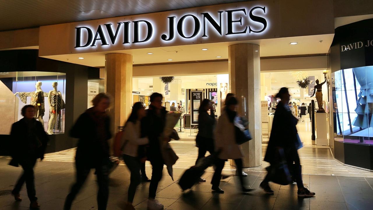 Shoppers make a dash down Bourke Street during busy trading hours.