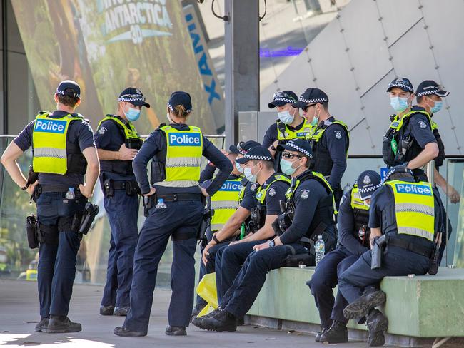 Victoria Police are seen outside the Melbourne Museum vaccination hub. Picture: Mark Stewart