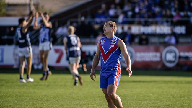 Kye Maniotis is seen while Glenunga players celebrate during the match in Adelaide, Saturday, September 8, 2018. (AAP Image/Morgan Sette)