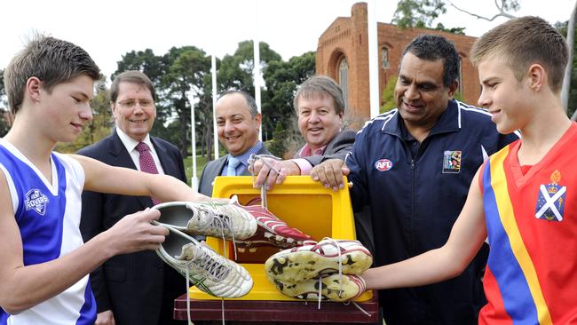 Leon Egan (second right) continued to work in football administration.