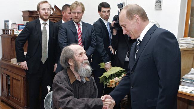 Putin, right, visits Alexander Solzhenitsyn, centre, in his house in Troitse-Lykovo in the outskirts of Moscow. Shown in the background are, Solzhenitsyn's sons, Stepan, far left, and Yermolai, wearing red striped tie. Solzhenitsyn, the Nobel Prize-winning author whose books chronicled the horrors of the Soviet gulag system died of heart failure in 2008. He was 89.