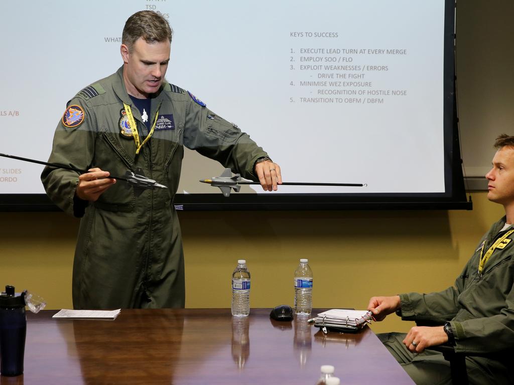 Australian Pilots training in the F35 fighter Jets Luke Airforce Base in Phoenix Arizona. Squadron leader Wing Commander Darren Clare (L) briefs Flight Lieutenant “Damo” before a flight . Picture: Nathan Edwards