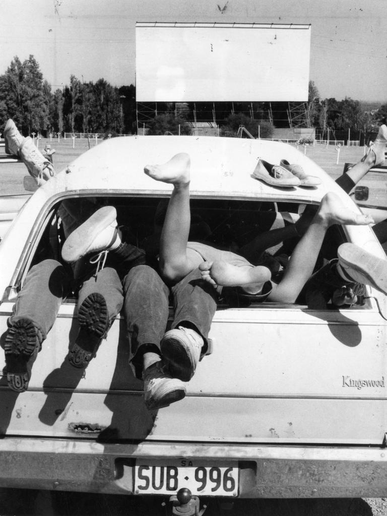 Legs hanging out of a full motor car at an Adelaide drive-in movie theatre in January 1986.