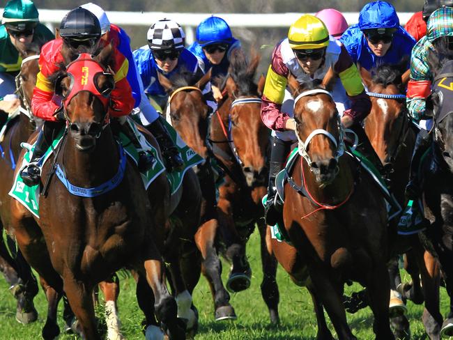 Loving home ridden by Tye Angland  (yellow cap, maroon with yellow armbands) wins race 1 during Scone  Races located in the Upper Hunter Region of NSW. The Bend . Pic Jenny Evans