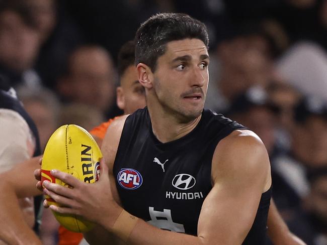 MELBOURNE, AUSTRALIA - APRIL 20: Marc Pittonet of the Blues runs with the ball during the round six AFL match between Carlton Blues and Greater Western Sydney Giants at Marvel Stadium, on April 20, 2024, in Melbourne, Australia. (Photo by Darrian Traynor/Getty Images)