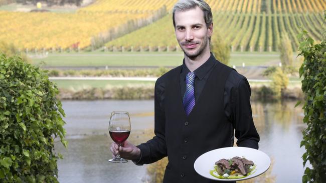 Josef Chromy restaurant manager Mitch Wright with an apple roasted lamb rump with Elphin Grove Farm Ccleriac, braised green lentils and celeriac labna. Picture: CHRIS KIDD