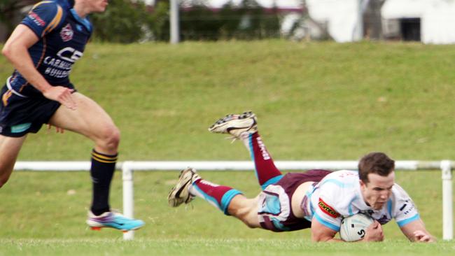 Michael Comerford scores a try during the 2011 Queensland Cup season.