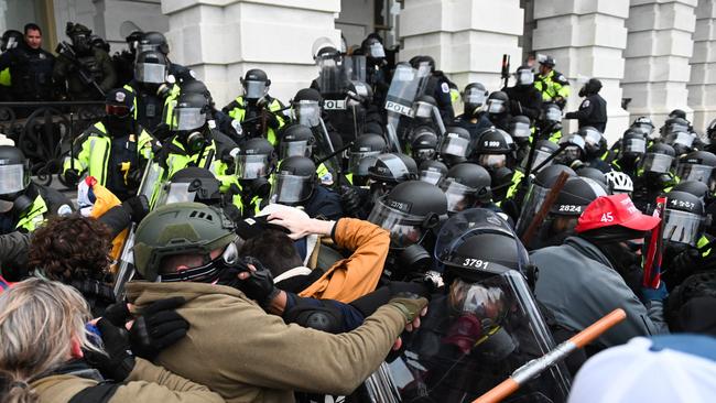 Riot police push back protesters outside the US Capitol building on January 6. Picture: Roberto Schmidt/AFP