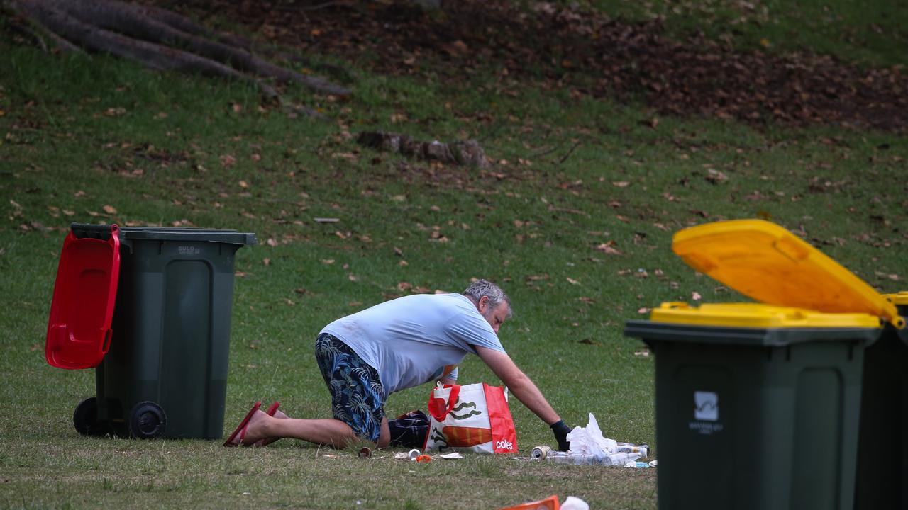 A local in seen clearing the park on Tuesday morning. Photo by: NCA Newswire/ Gaye Gerard