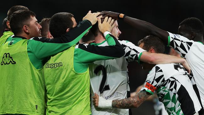 Aaron Calver of United celebrates with teammates after scoring a goal against the Western Sydney Wanderers Picture: Getty Images