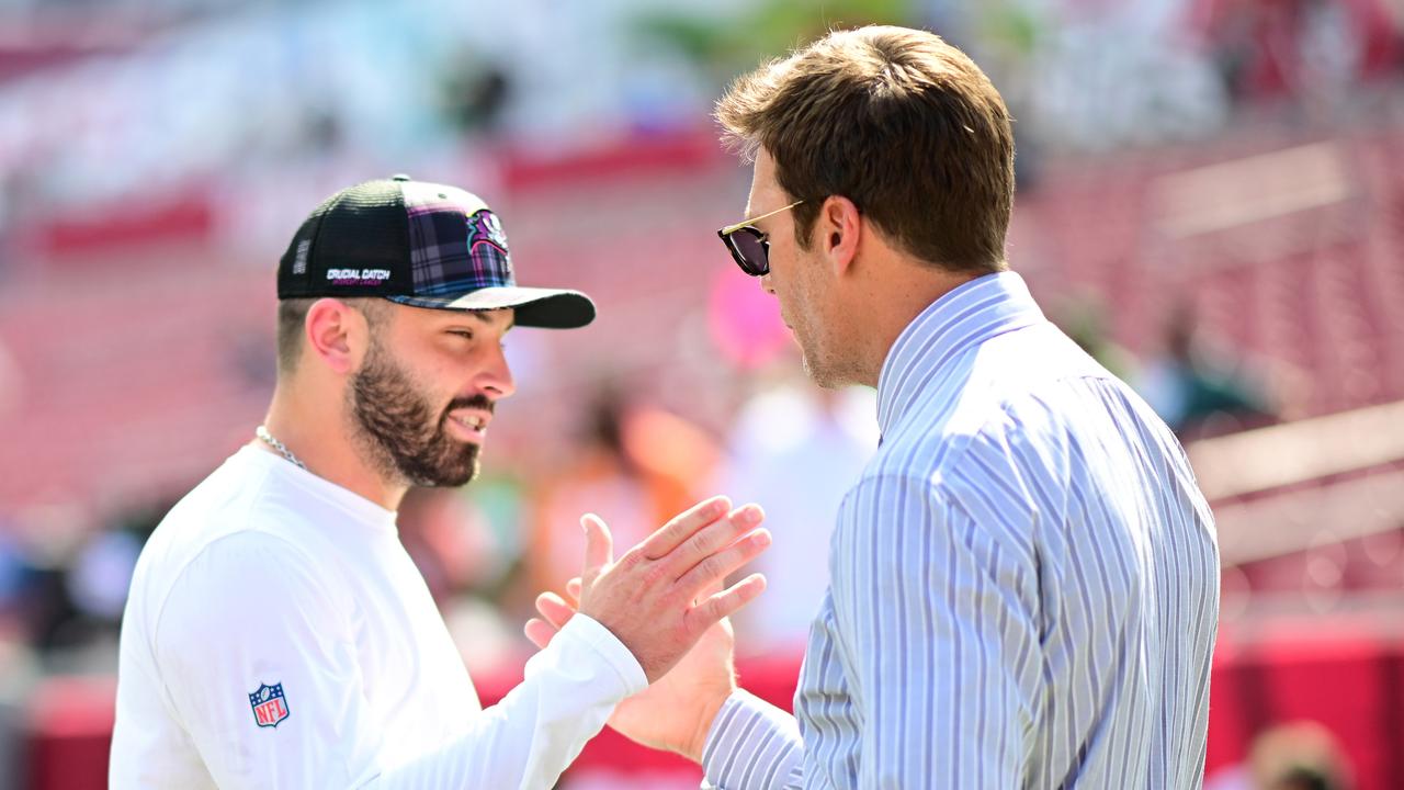 TAMPA, FLORIDA - SEPTEMBER 29: Baker Mayfield #6 of the Tampa Bay Buccaneers and former NFL player Tom Brady embrace prior to a game against the Philadelphia Eagles at Raymond James Stadium on September 29, 2024 in Tampa, Florida. (Photo by Julio Aguilar/Getty Images)