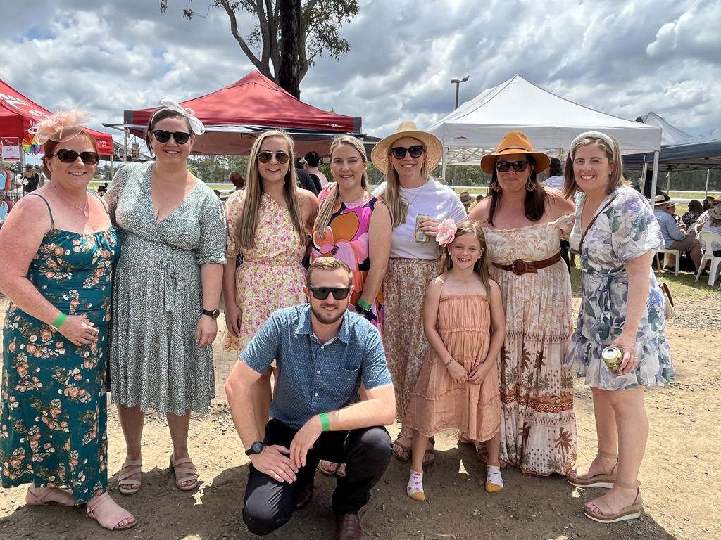 A big group having an absolute ball at the Torbanlea Picnic Races.