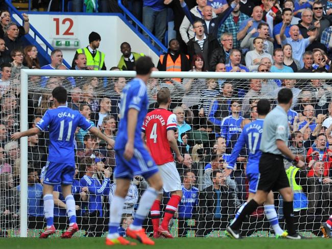 Chelsea midfielder Oscar scores the home side’s fifth goal against Arsenal. 