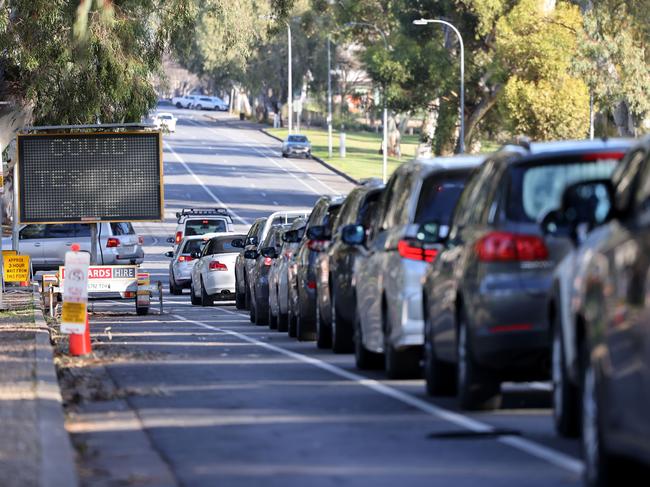 Cars line up at the Covid-10 testing clinic at Victoria Park Adelaide. Picture: NCA NewsWire / David Mariuz