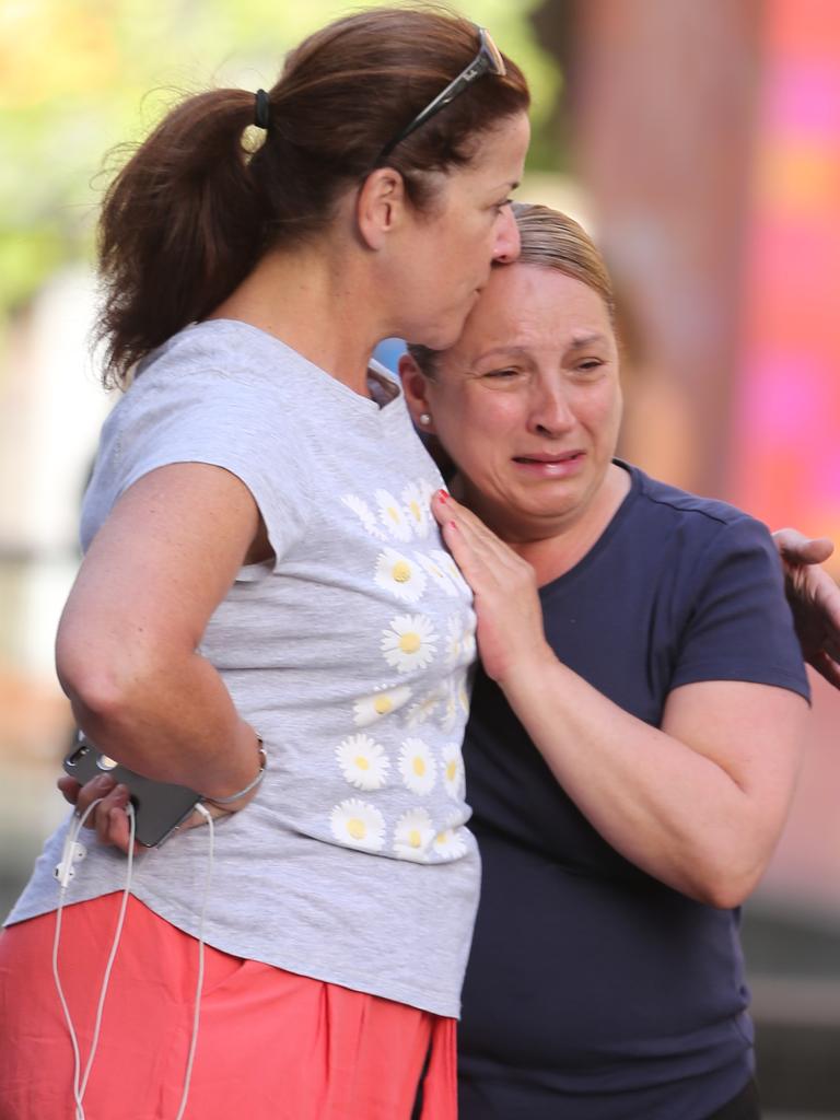 Commuters cry at Martin Place after the siege ended. Picture: John Grainger