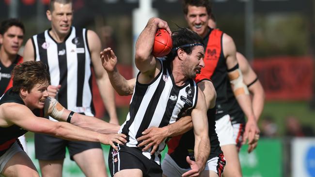 Action from the 2022 SFL grand final between Reynella and Morphett Vale. Picture: Tricia Watkinson