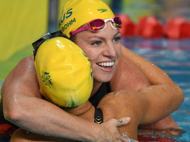 Australia 's Emily Seebohm celebrates after winning the swimming women's 50m backstroke final during the 2018 Gold Coast Commonwealth Games at the Optus Aquatic Centre in the Gold Coast on April 10, 2018 / AFP PHOTO