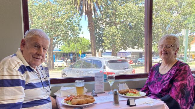 Bob and Marion Donoghue treated themselves to a chicken schnitty at the Narromine United Services Memorial Club which hosted a luncheon on Melbourne Cup Day 2021. Picture: Ryan Young