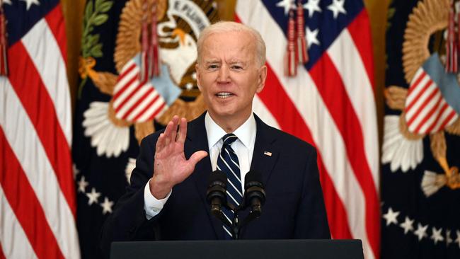 US President Joe Biden answers a question during his first press briefing in the East Room of the White House in Washington.