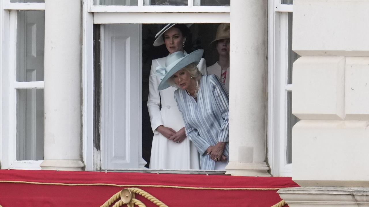 Catherine, Duchess of Cambridge, and Camilla, Duchess of Cornwall peep outside during Trooping The Colour. Picture: Matt Dunham/Getty Image