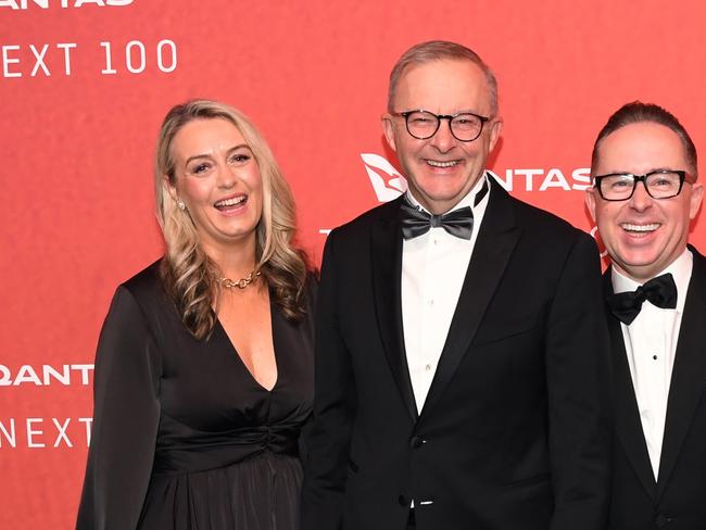 SYDNEY, AUSTRALIA - MARCH 31: Australian Prime Minister Anthony Albanese (C) stands with his partner Jodie Haydon and Qantas CEO Alan Joyce as they attend the Qantas 100th Gala Dinner at Jetbase 96 hangar at Sydney's International Airport on March 31, 2023 in Sydney, Australia. (Photo by James D. Morgan/Getty Images)