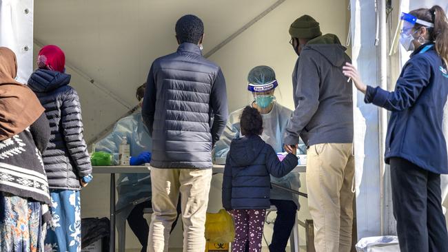 Families from the Flemington public housing queue for a test. Picture: NCA NewsWire/David Geraghty