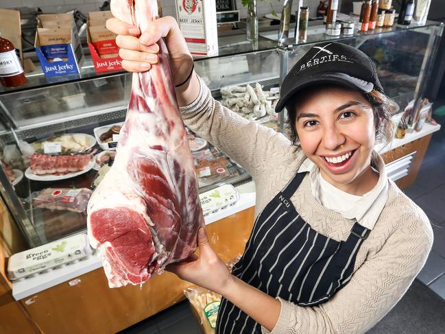 Lamb prices are on the rise around Victoria. Burties Butcher staff member Jessica with a lamb leg and lion chops. Picture: Tim Carrafa