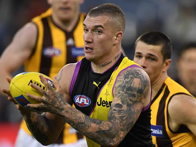 Dustin Martin of the Tigers (left) is seen in action during the Round 20 AFL match between the Richmond Tigers and the Hawthorn Hawks at the MCG in Melbourne, Sunday, August 6 , 2017. (AAP Image/Julian Smith) NO ARCHIVING, EDITORIAL USE ONLY