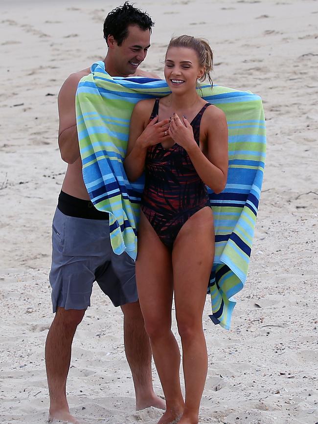 After a quick flirty dip in the water, Lindahl wraps a towel around Khamula. Picture: DIIMEX