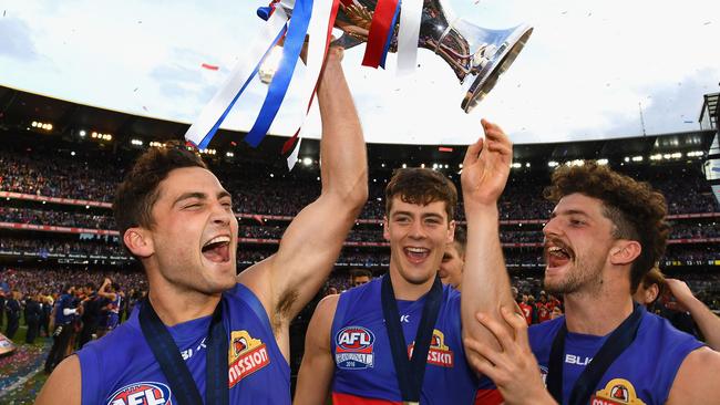 Any misgivings Josh Dunkley (centre) had about being passed over by the Swans on draft night disappeared on Grand Final day.