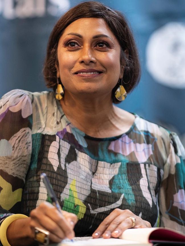 Indira Naidoo signing copies of her book.