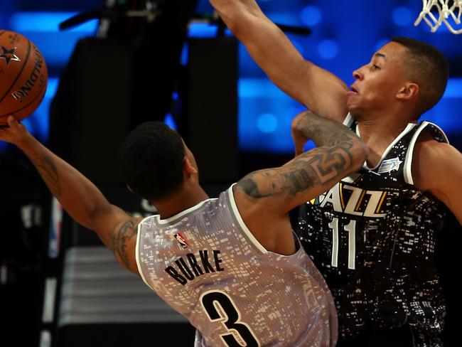 NEW YORK, NY - FEBRUARY 13: World Team's Dante Exum #11 of the Utah Jazz defends against U.S. Team's Trey Burke #3 of the Utah Jazz during the BBVA Compass Rising Stars Challenge as part of the 2015 NBA Allstar Weekend at the Barclays Center on February 13, 2015 in the Brooklyn borough of New York City. NOTE TO USER: User expressly acknowledges and agrees that, by downloading and or using this photograph, User is consenting to the terms and conditions of the Getty Images License Agreement. (Photo by Elsa/Getty Images)