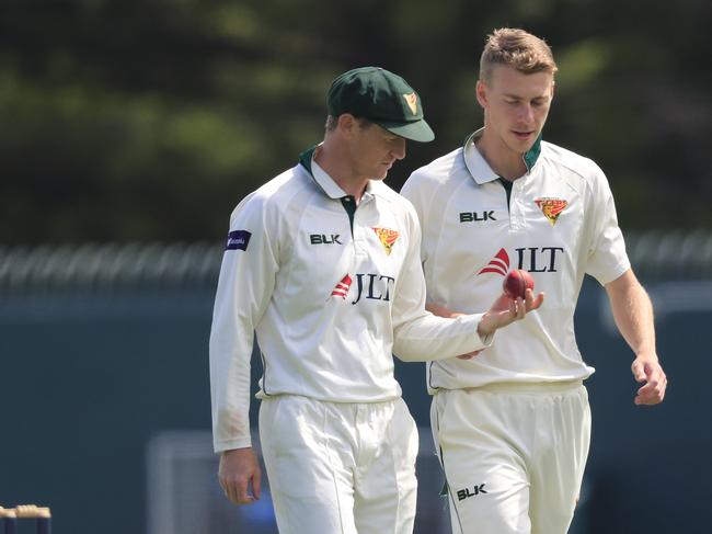 George Bailey (left) and Riley Meredith of the Tigers on day two of the Round 6 Sheffield Shield match between Tasmania and Queensland at Blundstone Arena. Picture: AAP Image/ROB BLAKERS