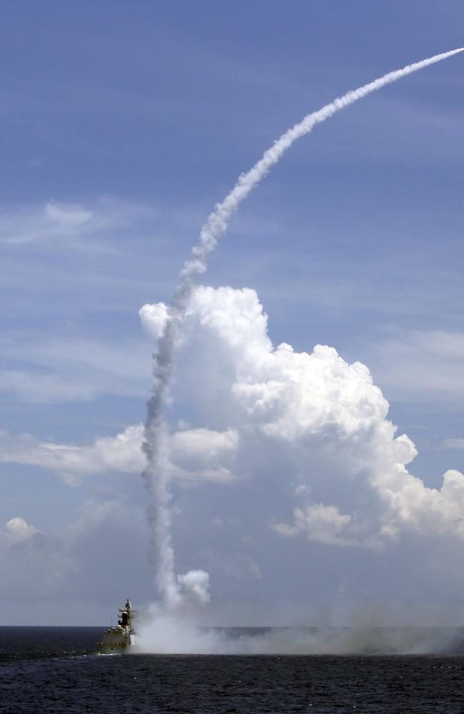 A Chinese missile frigate launches an air-defence missile during a military exercise in the waters near south China's Hainan Island and Paracel Islands. Picture: AP