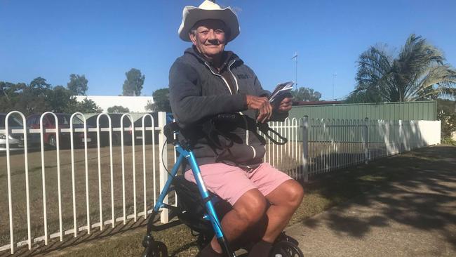 Giving a wave: Gary Ostrofski has become famous around Bundaberg for waving to cars travelling past FE Walker St.