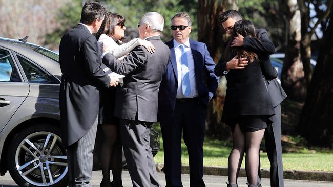 The Kelly family comfort each other at Stuart’s funeral. Picture: Craig Greenhill