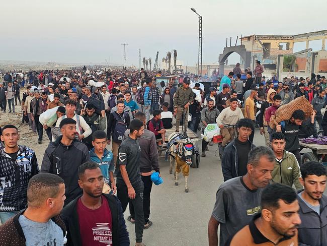Displaced Palestinians return from a food distribution centre in Rafah in the southern Gaza Strip. Picture: AFP