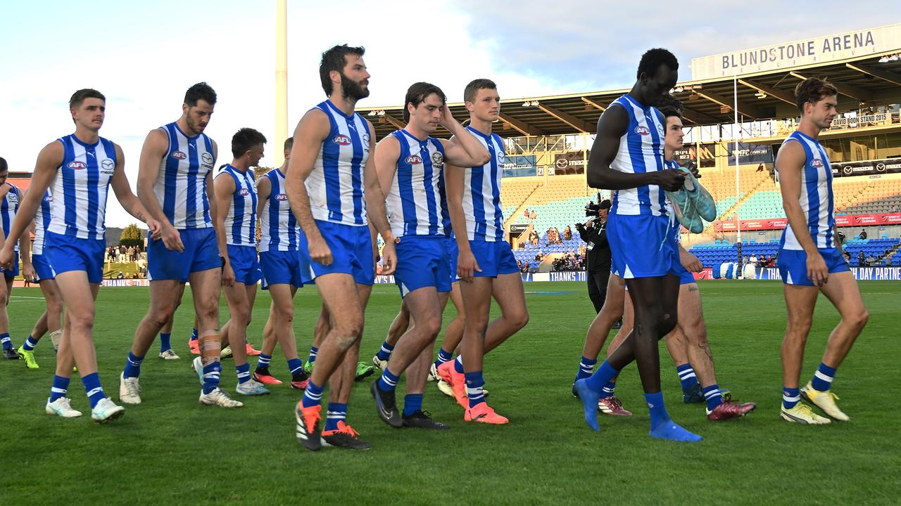 HOBART, AUSTRALIA - APRIL 27: Kangaroos players leave the field after the game during the round seven AFL match between North Melbourne Kangaroos and Adelaide Crows at Blundstone Arena, on April 27, 2024, in Hobart, Australia. (Photo by Steve Bell/Getty Images)