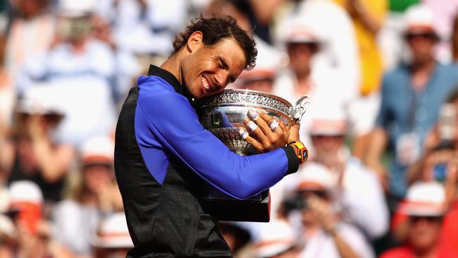 Rafael Nadal of Spain celebrates victory with the trophy following the mens singles final against Stan Wawrinka of Switzerland on day fifteen of the 2017 French Open at Roland Garros.