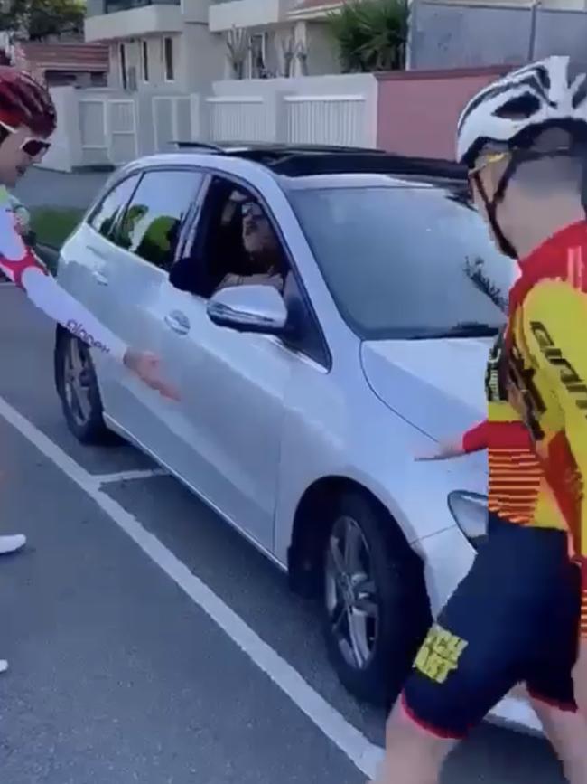 Other riders also become involved in the argument.